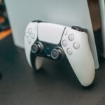 PlayStation 5 controller resting on the console, ready to play retro classics