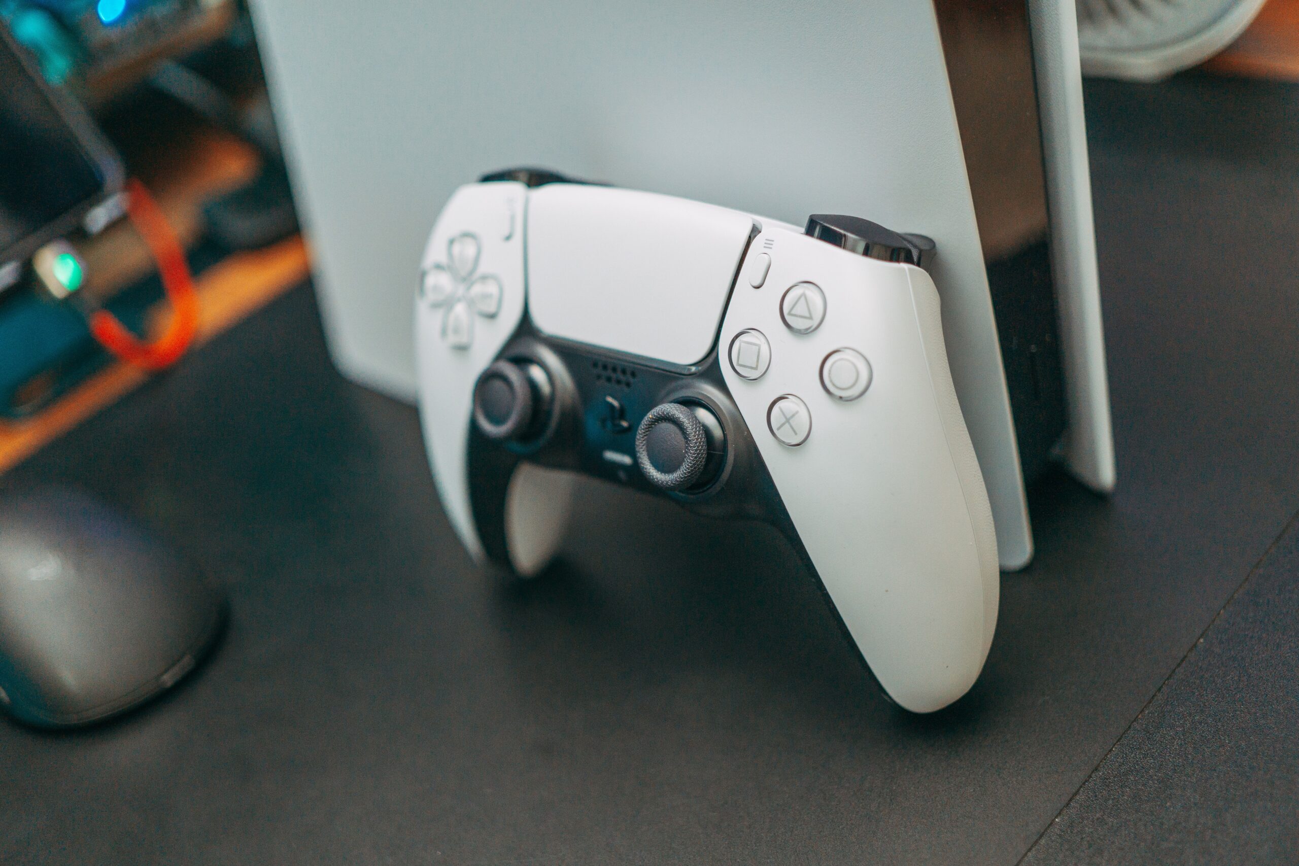 PlayStation 5 controller resting on the console, ready to play retro classics