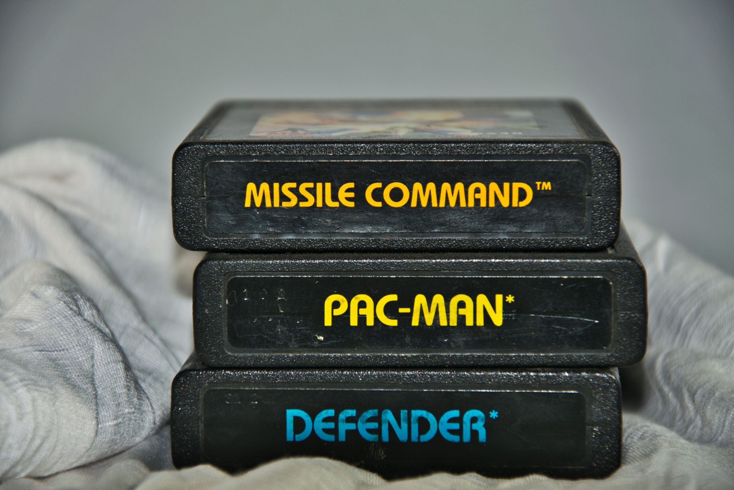 Vintage Atari game cartridges for Missile Command, Pac-Man and Defender