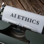 Macchina da scrivere con foglio su cui è scritto AI Ethics: etica e copyright dei contenuti generati dall'intelligenza artificiale
