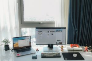 MacBook laptop used for retro gaming with a gamepad