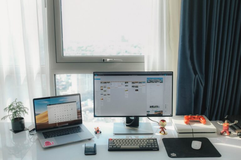 MacBook laptop used for retro gaming with a gamepad