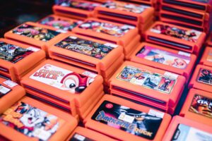 Stacked retro video game cartridges ready to be bought at a retro games store