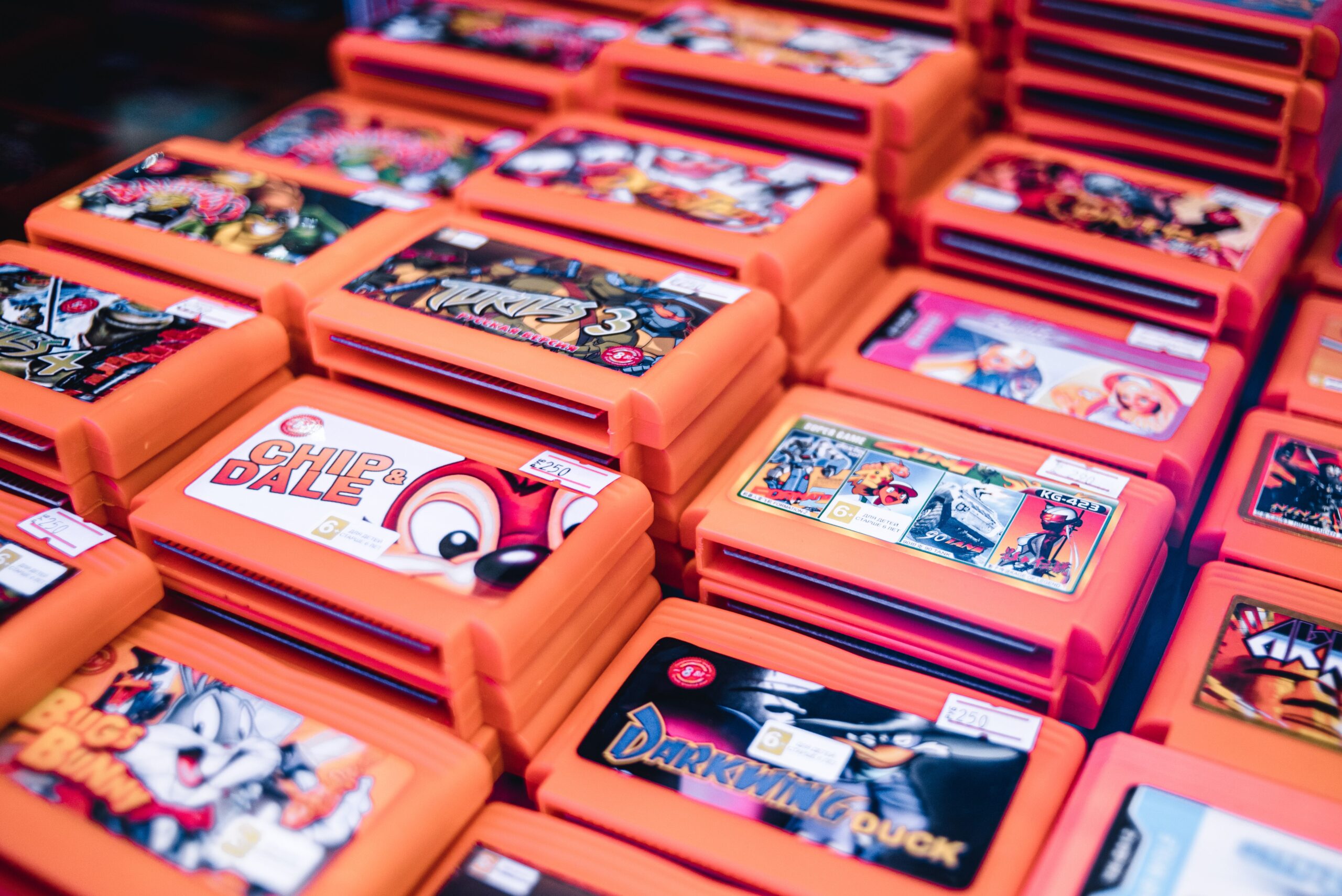 Stacked retro video game cartridges ready to be bought at a retro games store