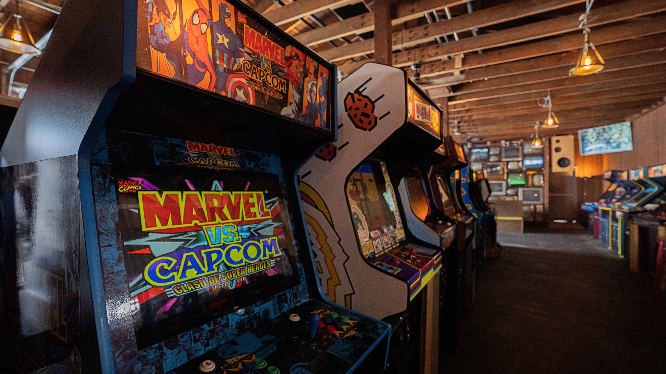Retro arcade cabinets with joysticks and control panels, the classic home arcade experience