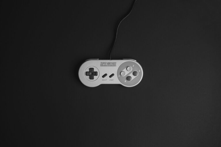A Super Nintendo controller on a black background, the perfect image for a guide to the best SNES games of all time.