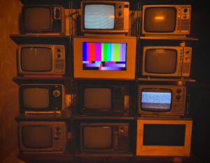Vintage CRT televisions showing test patterns for retro gaming