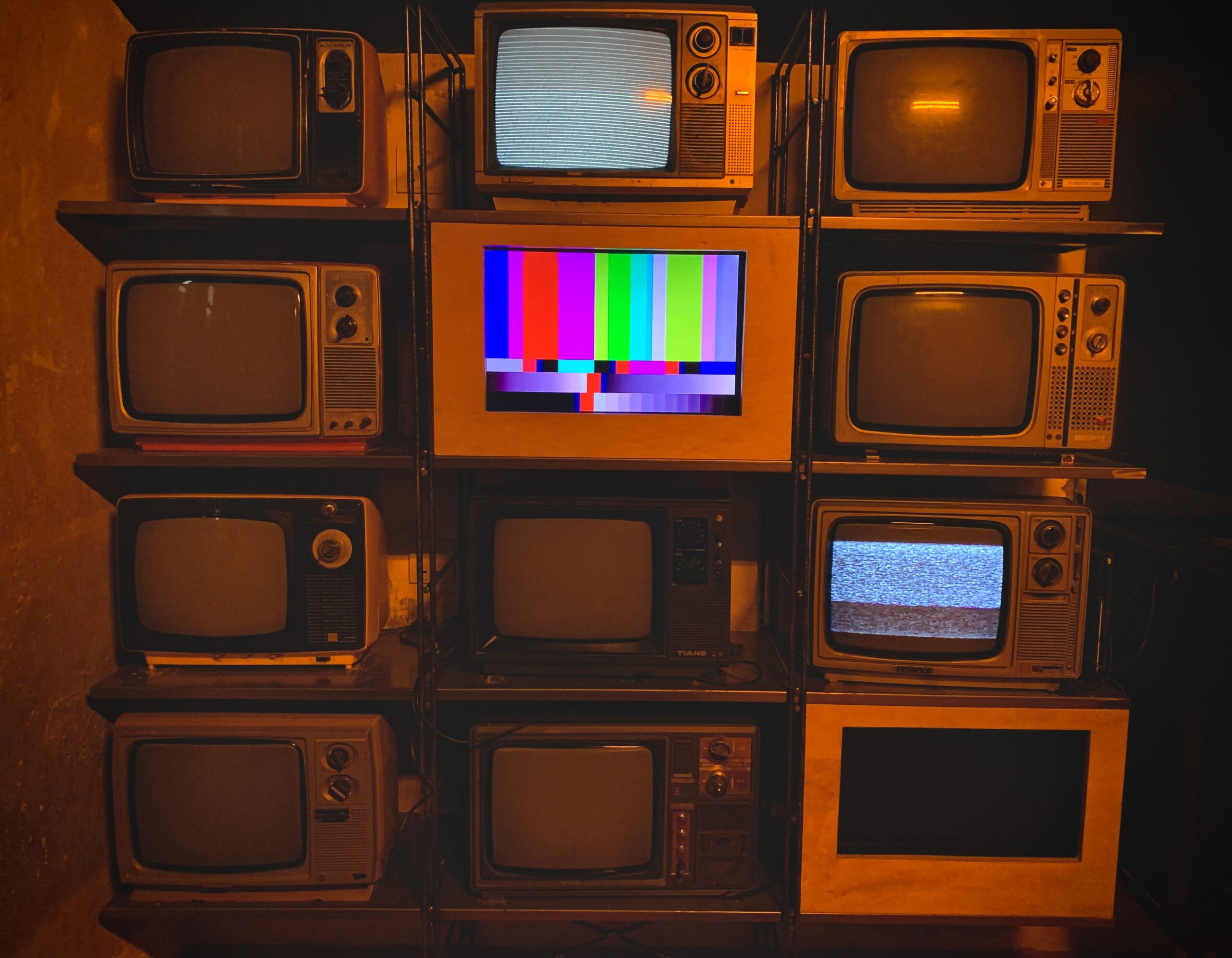 Vintage CRT televisions showing test patterns for retro gaming